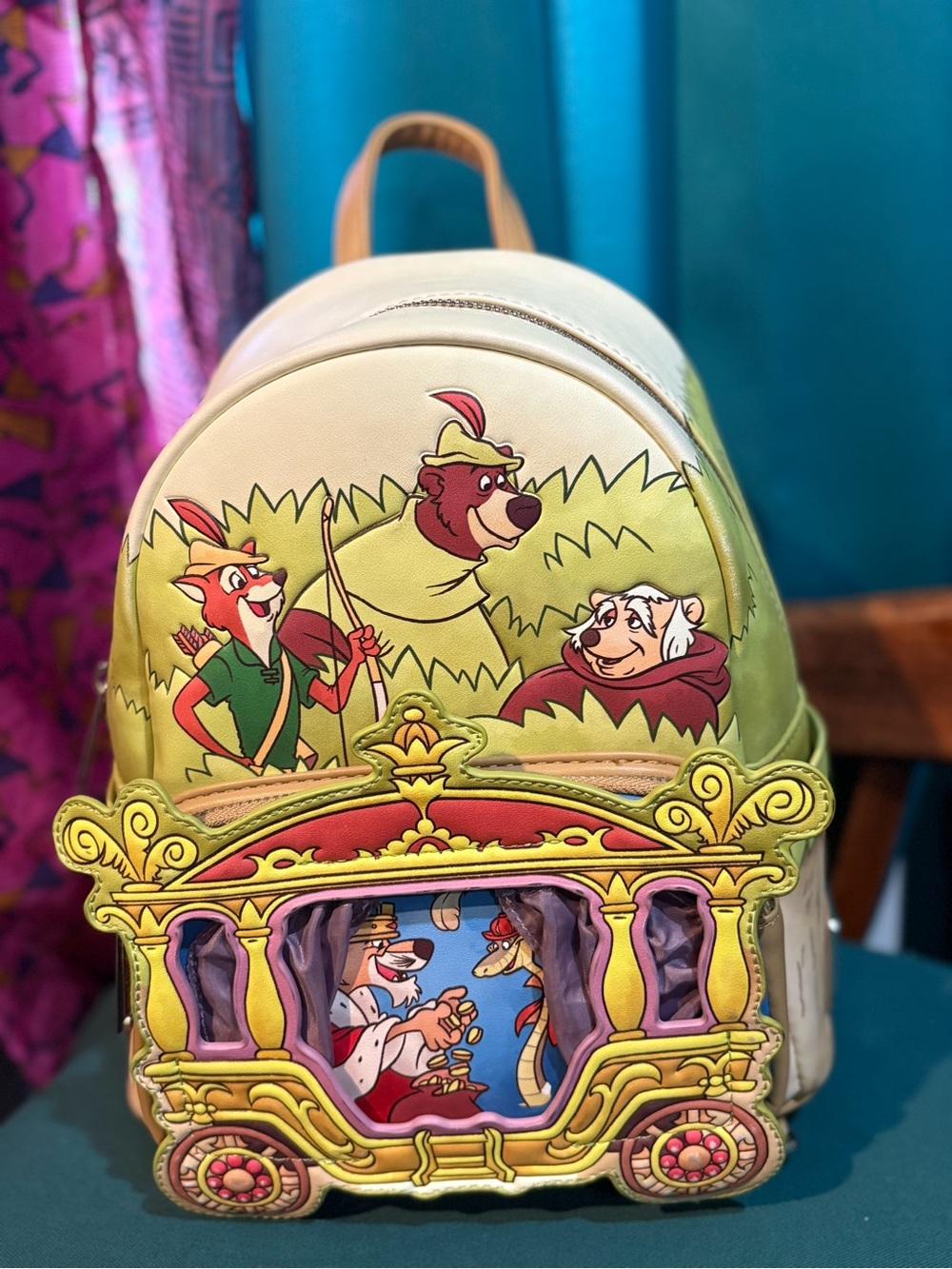 Loungefly Disney Robin Hood Mini Backpack. Green with Multicolor Carriage Detail
